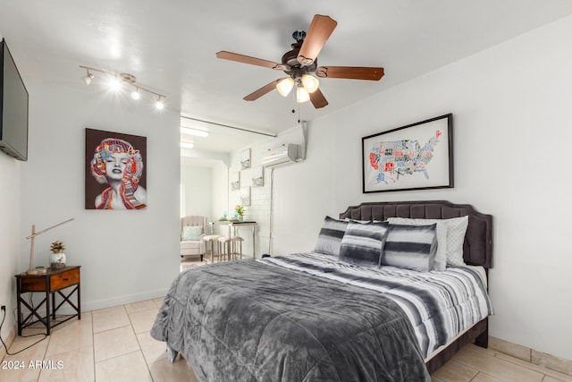 bedroom featuring a wall unit AC, ceiling fan, and light tile patterned floors