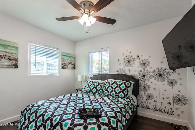 bedroom featuring dark wood-type flooring and ceiling fan