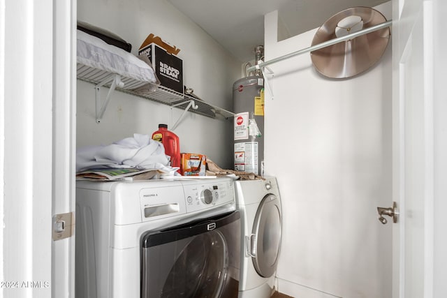 washroom with gas water heater and independent washer and dryer