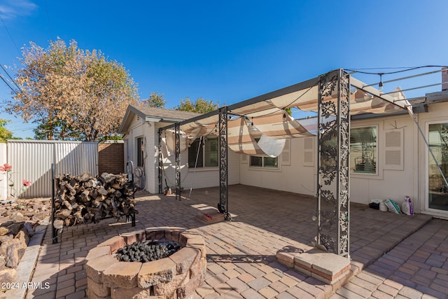 view of patio featuring a fire pit