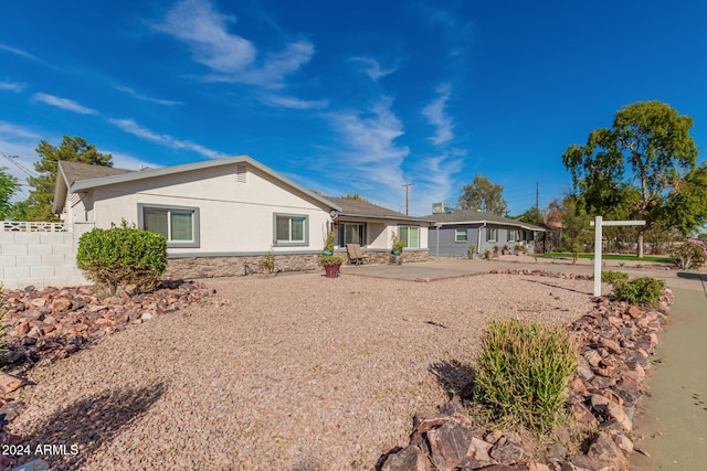 2518 E Campbell Ave, Phoenix, AZ 85016 - single story home with stucco siding, fence, stone siding, and a patio area