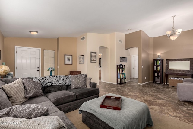 4038 E Wrangler Ct, Gilbert, AZ 85297 - living area featuring arched walkways, vaulted ceiling, a chandelier, and baseboards