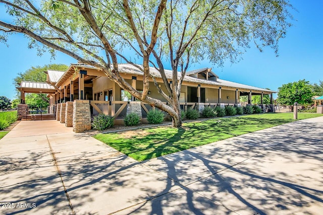 4038 E Wrangler Ct, Gilbert, AZ 85297 - view of front facade with metal roof and driveway