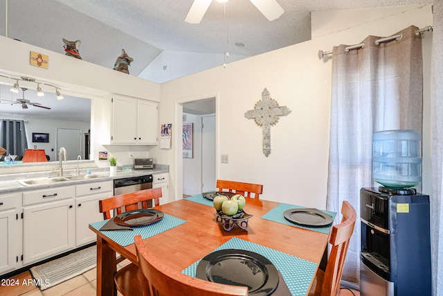 dining area with sink, a textured ceiling, and ceiling fan