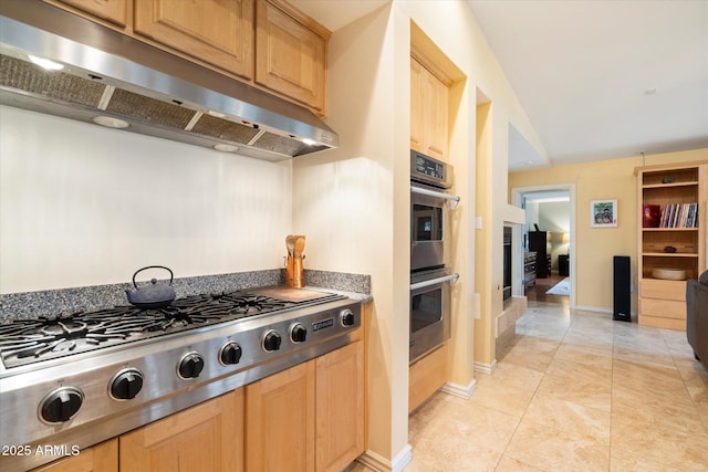 5535 N 13th St, Phoenix, AZ 85014 - kitchen featuring light tile patterned flooring, appliances with stainless steel finishes, light brown cabinets, and under cabinet range hood
