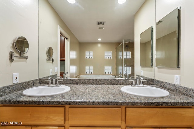 5535 N 13th St, Phoenix, AZ 85014 - bathroom with visible vents, recessed lighting, a stall shower, and a sink