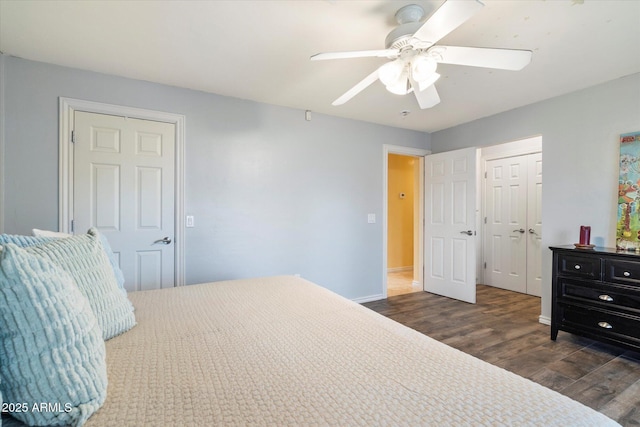 5535 N 13th St, Phoenix, AZ 85014 - bedroom with a closet, baseboards, dark wood-type flooring, and ceiling fan