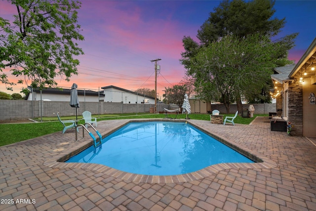 5535 N 13th St, Phoenix, AZ 85014 - pool at dusk with a patio, a yard, a fenced backyard, and a fenced in pool