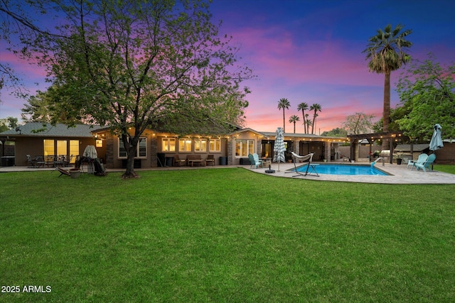 5535 N 13th St, Phoenix, AZ 85014 - pool at dusk featuring a patio area, a fenced in pool, a pergola, and a yard