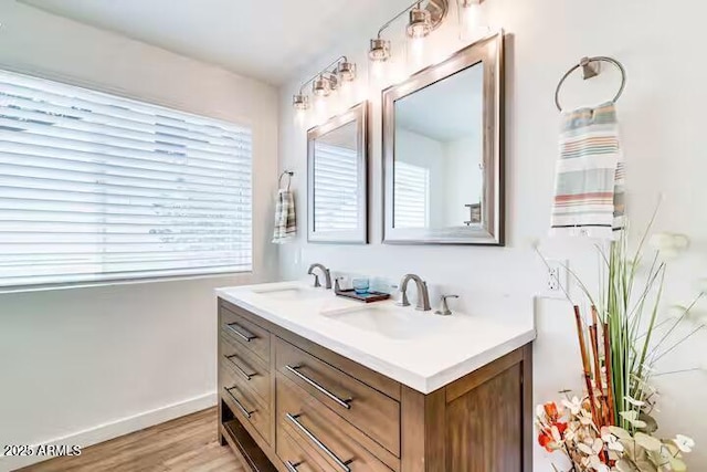 2723 Towell St, Overgaard, AZ 85933 - full bathroom featuring double vanity, wood finished floors, and baseboards