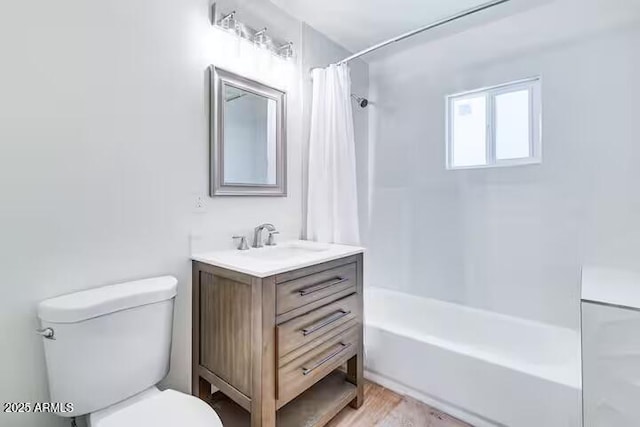 2723 Towell St, Overgaard, AZ 85933 - full bath with vanity, toilet, shower / bath combo with shower curtain, and wood finished floors