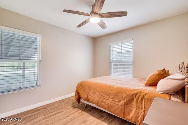 2723 Towell St, Overgaard, AZ 85933 - bedroom featuring baseboards, wood finished floors, and ceiling fan