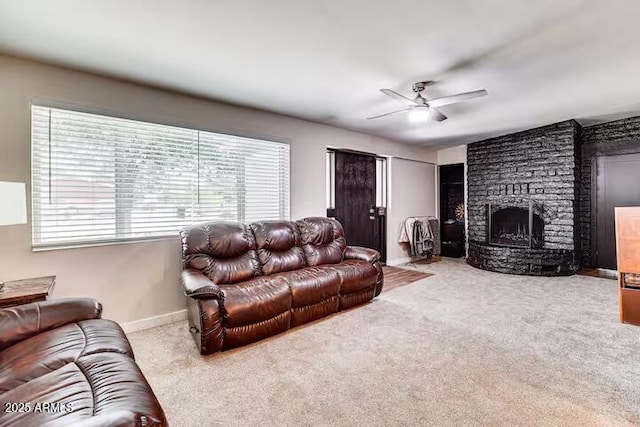 2723 Towell St, Overgaard, AZ 85933 - carpeted living area featuring ceiling fan, a stone fireplace, and baseboards