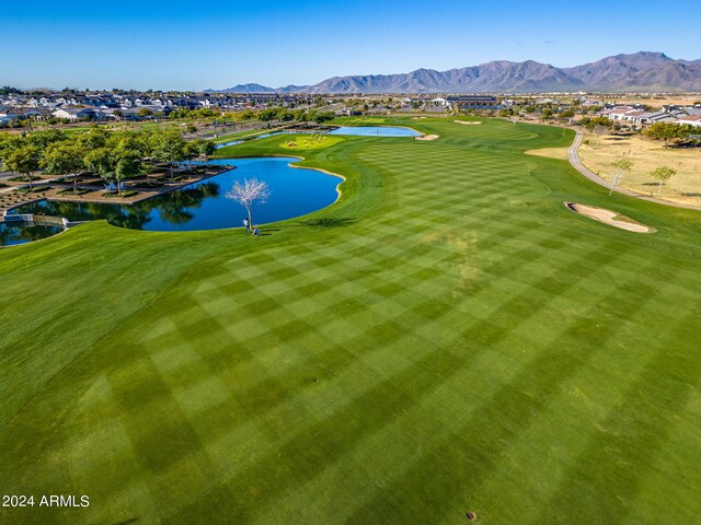 drone / aerial view featuring a water and mountain view