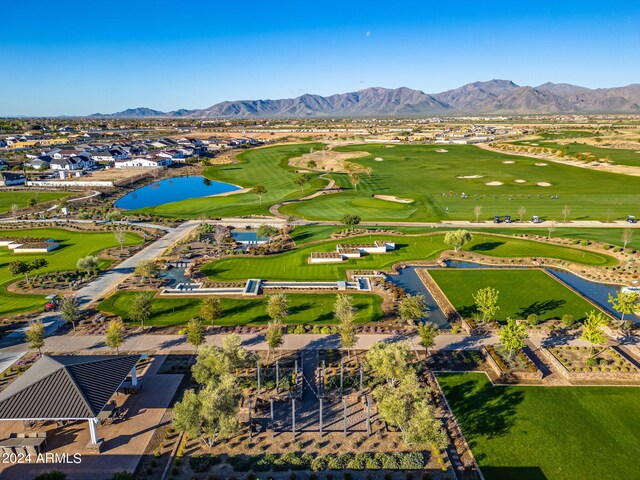 birds eye view of property with a water and mountain view