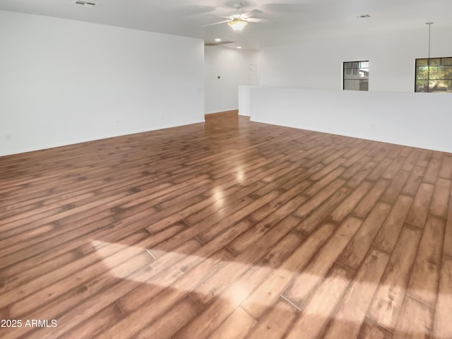 spare room with hardwood / wood-style flooring and ceiling fan