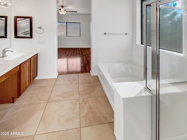 bathroom featuring ceiling fan, tile patterned floors, shower with separate bathtub, and vanity