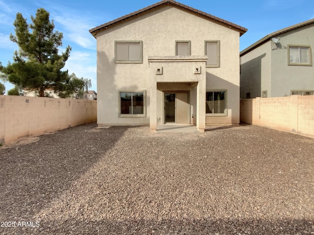 rear view of property with a patio