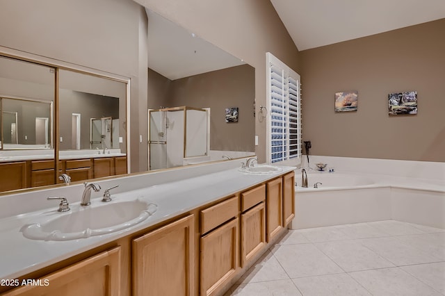 12754 E Laurel Ln, Scottsdale, AZ 85259 - full bathroom featuring vaulted ceiling, a stall shower, a bath, double vanity, and tile patterned flooring
