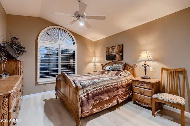 12754 E Laurel Ln, Scottsdale, AZ 85259 - bedroom with vaulted ceiling, light wood-type flooring, baseboards, and a ceiling fan