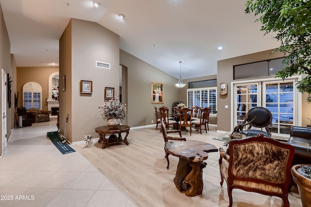 12754 E Laurel Ln, Scottsdale, AZ 85259 - living area featuring lofted ceiling, light tile patterned flooring, arched walkways, baseboards, and recessed lighting