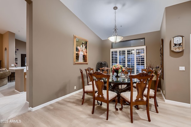 12754 E Laurel Ln, Scottsdale, AZ 85259 - dining space with vaulted ceiling, light wood-type flooring, and baseboards