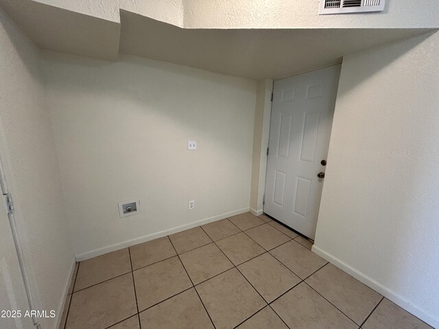 3814 N 55th Dr, Phoenix, AZ 85031 - spare room featuring light tile patterned floors and baseboards