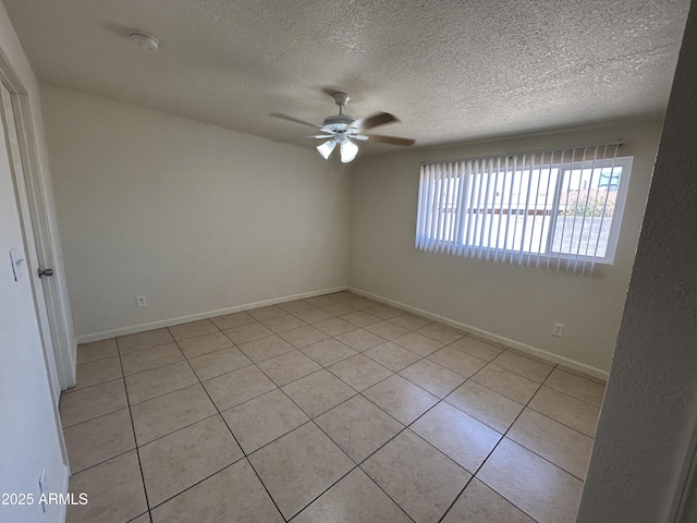 3814 N 55th Dr, Phoenix, AZ 85031 - empty room with a ceiling fan, a textured ceiling, light tile patterned floors, and baseboards