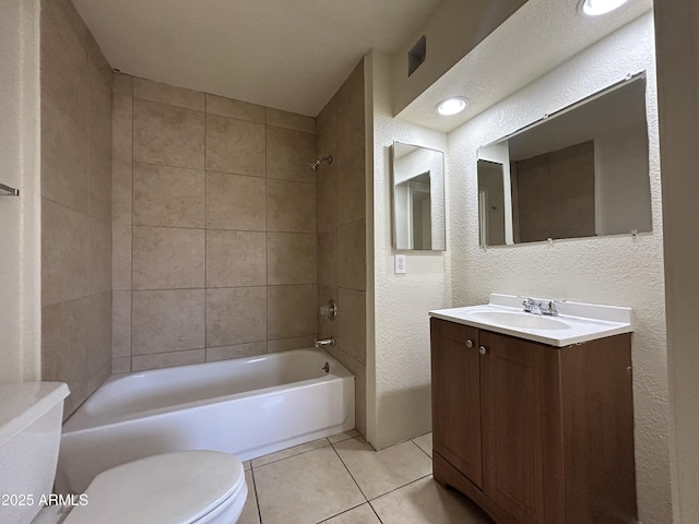 3814 N 55th Dr, Phoenix, AZ 85031 - full bathroom with a textured wall, toilet, tile patterned floors, vanity, and bathtub / shower combination