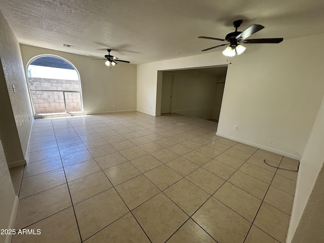3814 N 55th Dr, Phoenix, AZ 85031 - empty room featuring ceiling fan, light tile patterned floors, a textured ceiling, and baseboards