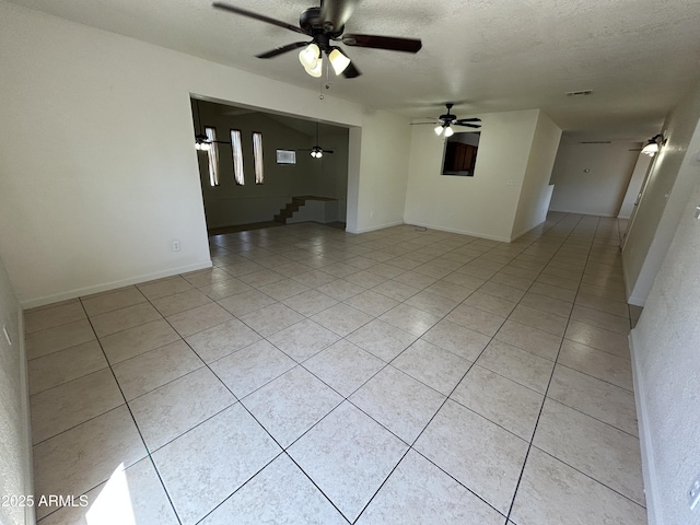 3814 N 55th Dr, Phoenix, AZ 85031 - unfurnished room featuring ceiling fan, light tile patterned flooring, a textured ceiling, and baseboards
