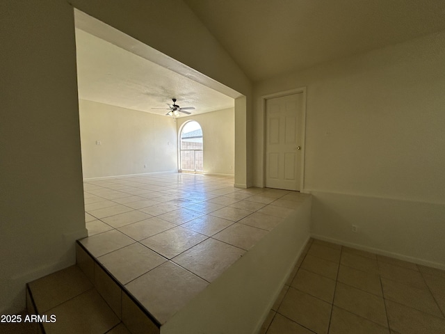 3814 N 55th Dr, Phoenix, AZ 85031 - unfurnished room with tile patterned floors, a ceiling fan, baseboards, and vaulted ceiling