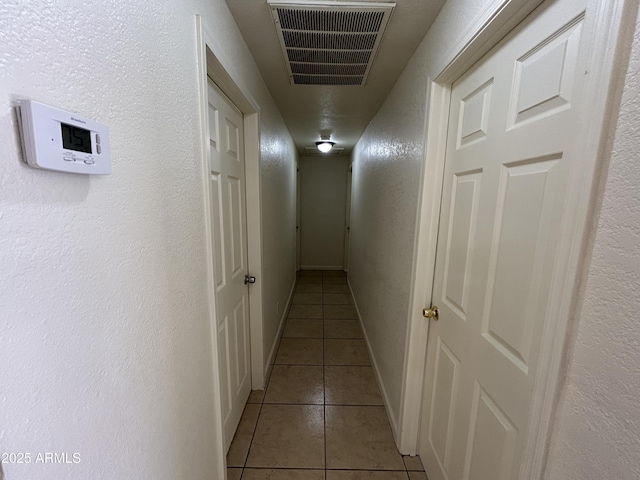 3814 N 55th Dr, Phoenix, AZ 85031 - corridor with light tile patterned floors and a textured wall