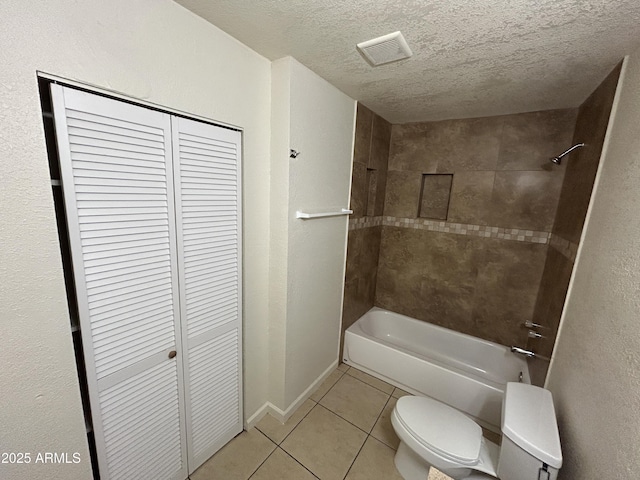 3814 N 55th Dr, Phoenix, AZ 85031 - full bath featuring toilet, tile patterned flooring, bathing tub / shower combination, a closet, and a textured ceiling