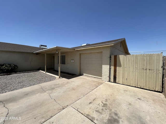 3814 N 55th Dr, Phoenix, AZ 85031 - view of front facade with an attached garage, concrete driveway, and stucco siding