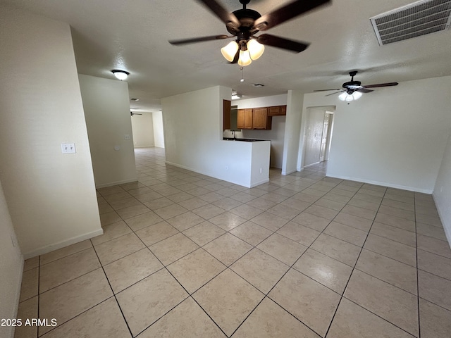 3814 N 55th Dr, Phoenix, AZ 85031 - unfurnished living room featuring ceiling fan, light tile patterned flooring, and baseboards