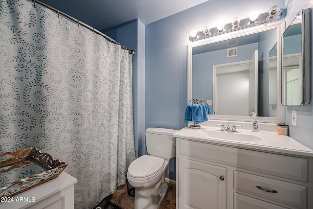 bathroom featuring a shower with curtain, vanity, and toilet