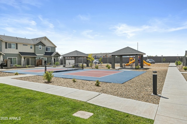 view of community with a gazebo, a yard, a playground, and tennis court