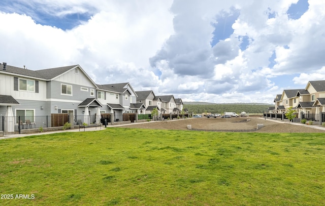 view of home's community with a lawn