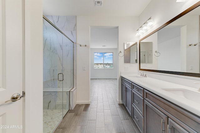 bathroom with vanity and an enclosed shower