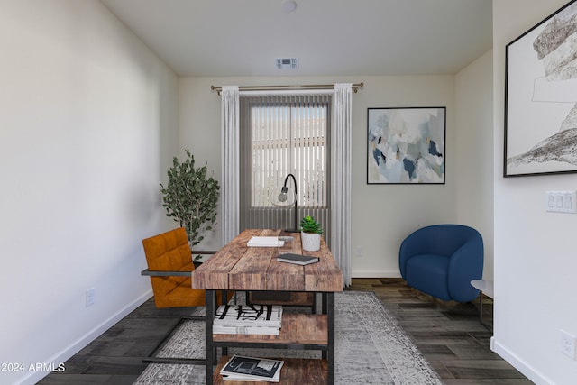 home office with dark hardwood / wood-style flooring