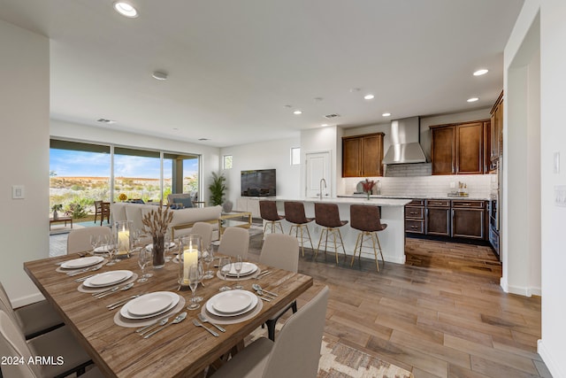 dining space with light wood-type flooring