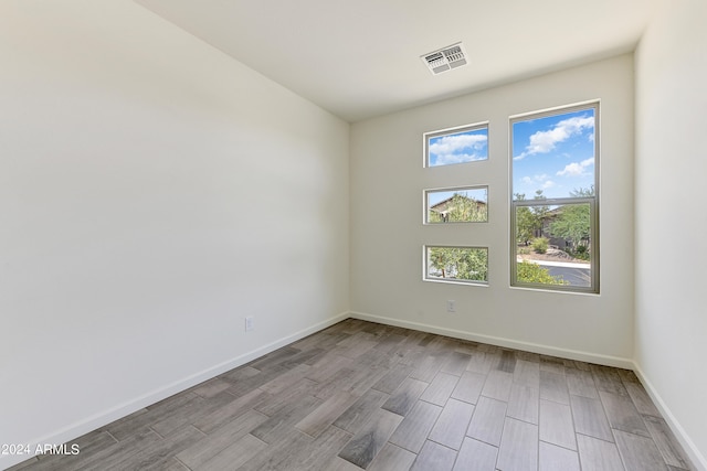 spare room with light wood-type flooring