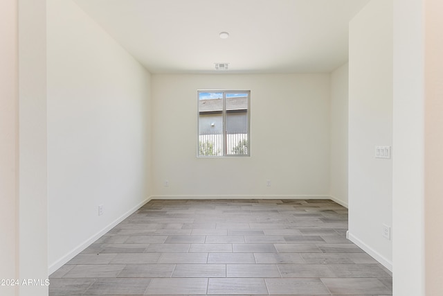 empty room with light hardwood / wood-style floors