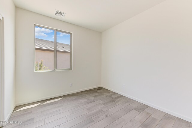 unfurnished room featuring light hardwood / wood-style flooring