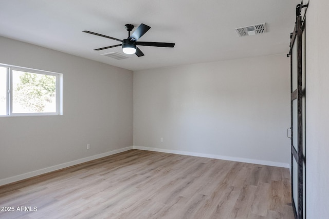 spare room with ceiling fan and light hardwood / wood-style floors