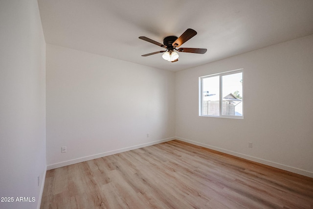 empty room with ceiling fan and light wood-type flooring