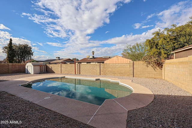 view of pool featuring a shed