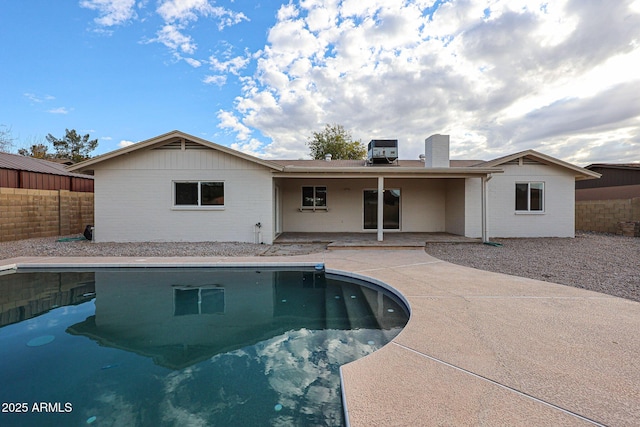 view of swimming pool featuring a patio area and central AC