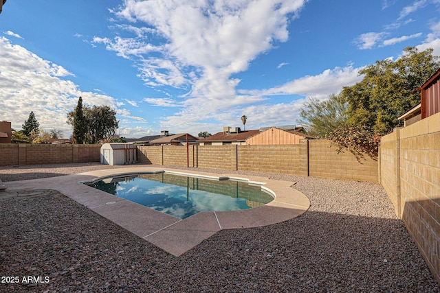 view of pool featuring a storage shed